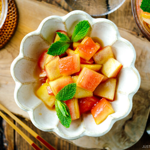 A fluted bowl containing Pickled Watermelon Rind.