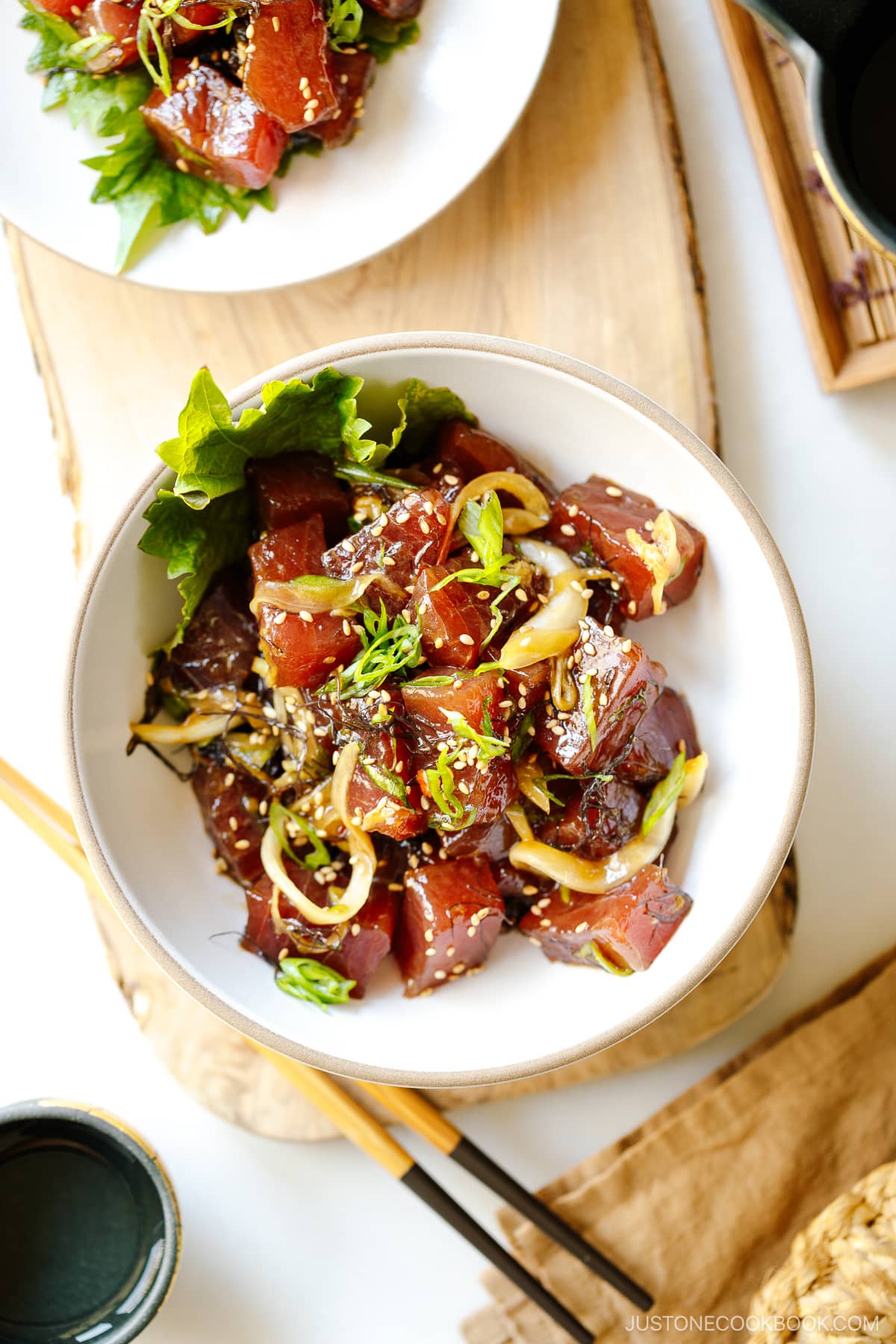 A white bowl containing Ahi Tuna Poke.