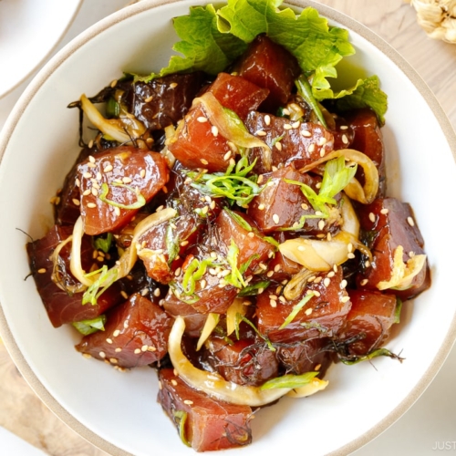 A white bowl containing Ahi Tuna Poke.