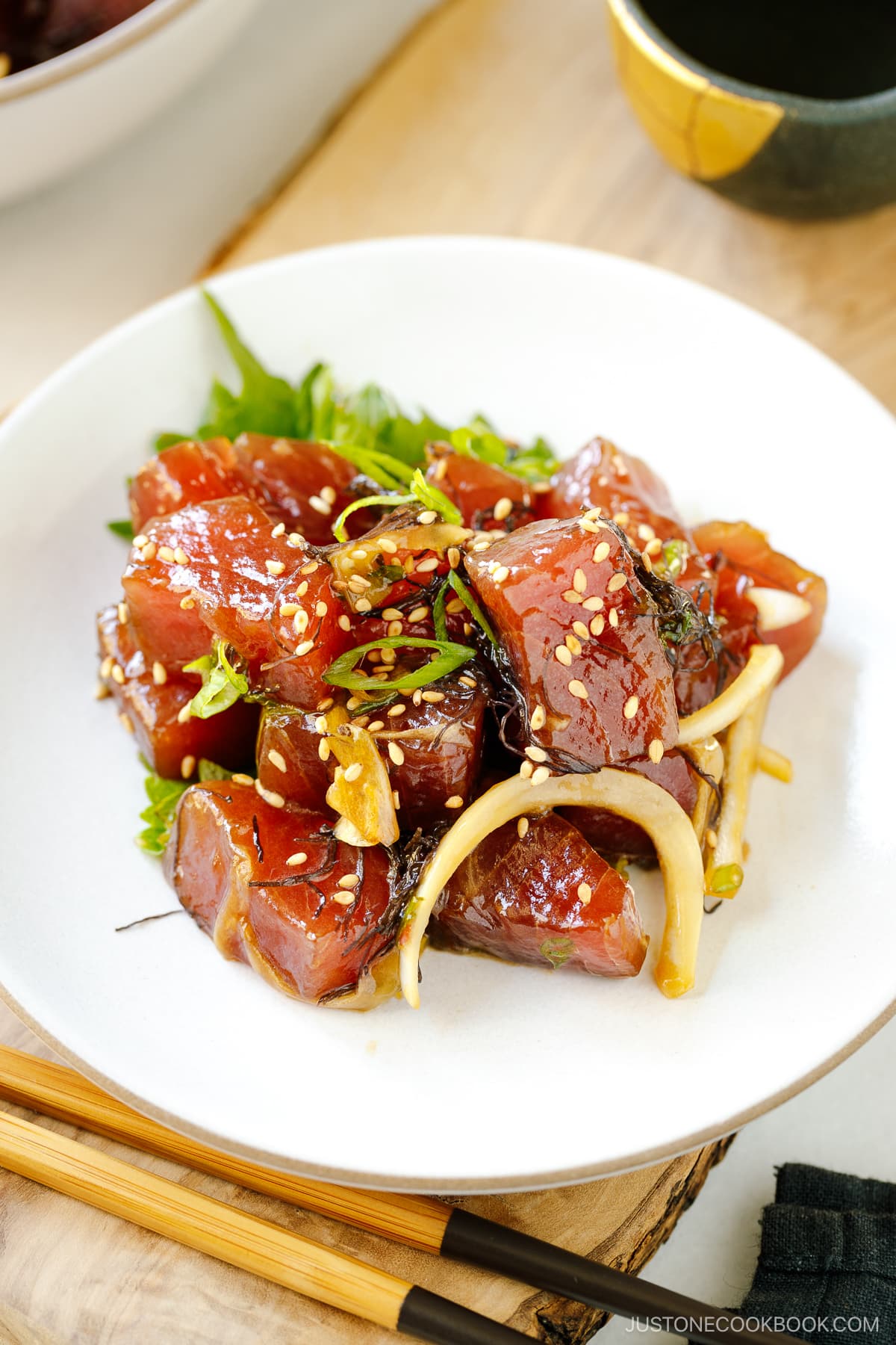 A white bowl containing Ahi Tuna Poke.