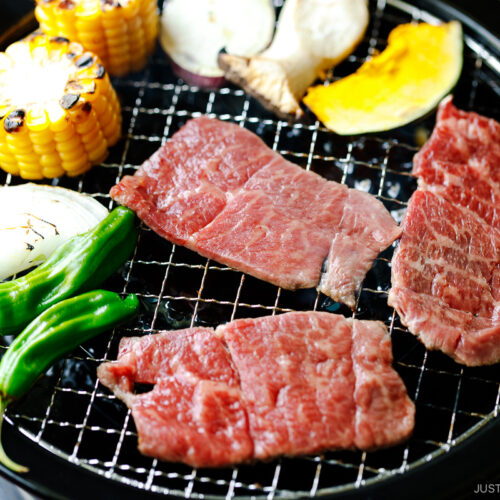 Grilling fresh vegetables and beef on a Japanese yakiniku grill top.