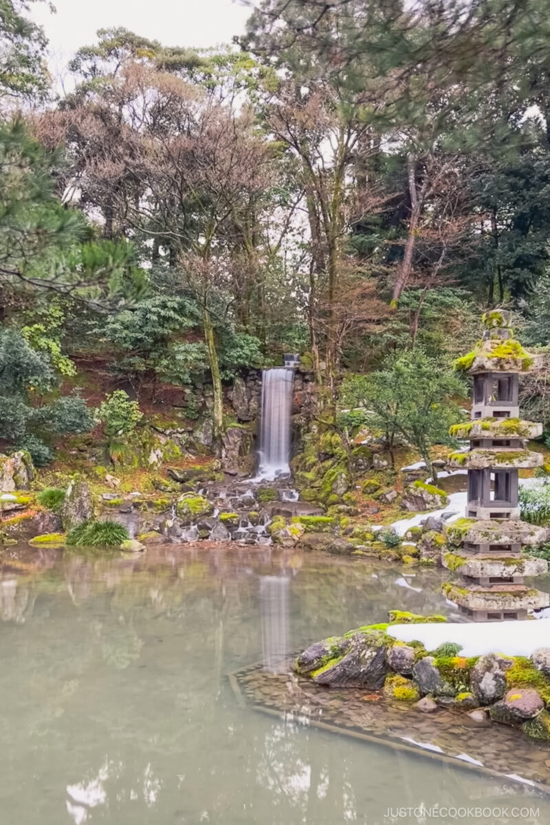 a small waterfall flowing into a pond