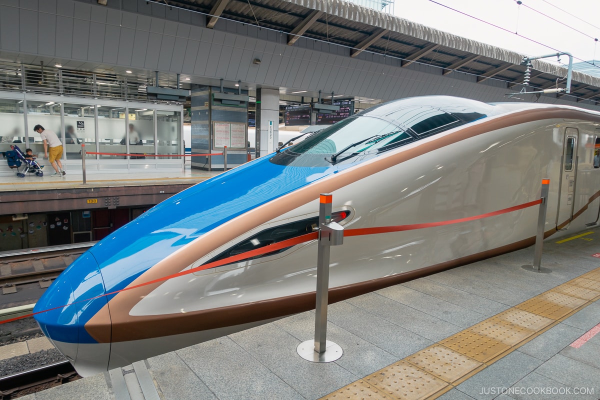 Shinkansen Bullet Train with gold and blue stripe