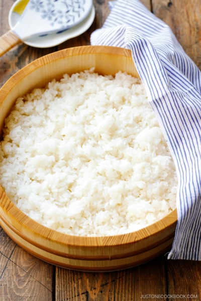 Sushi oke (Hangiri) containing sushi rice made with cooked Japanese short-grain rice, rice vinegar, sugar, and salt.