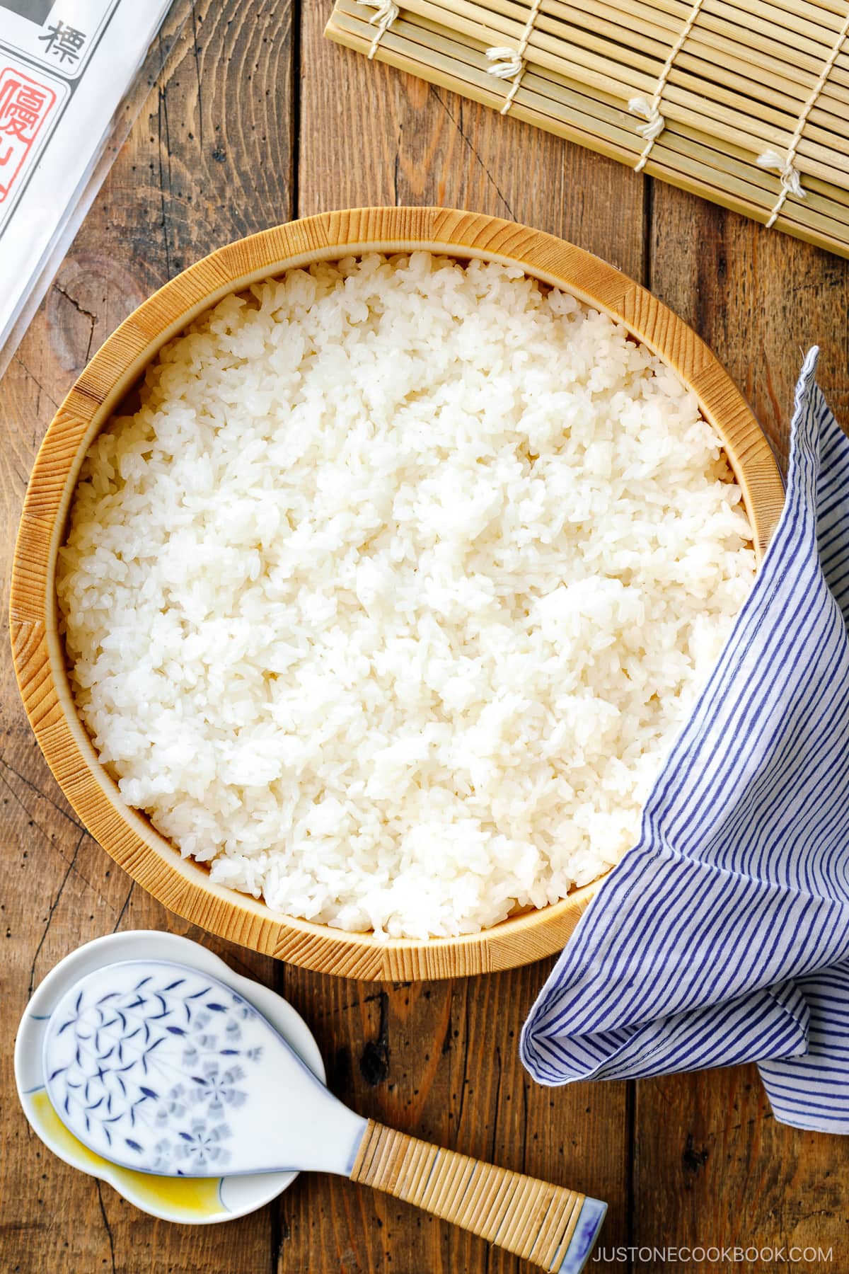 Sushi oke (Hangiri) containing sushi rice made with cooked Japanese short-grain rice, rice vinegar, sugar, and salt.