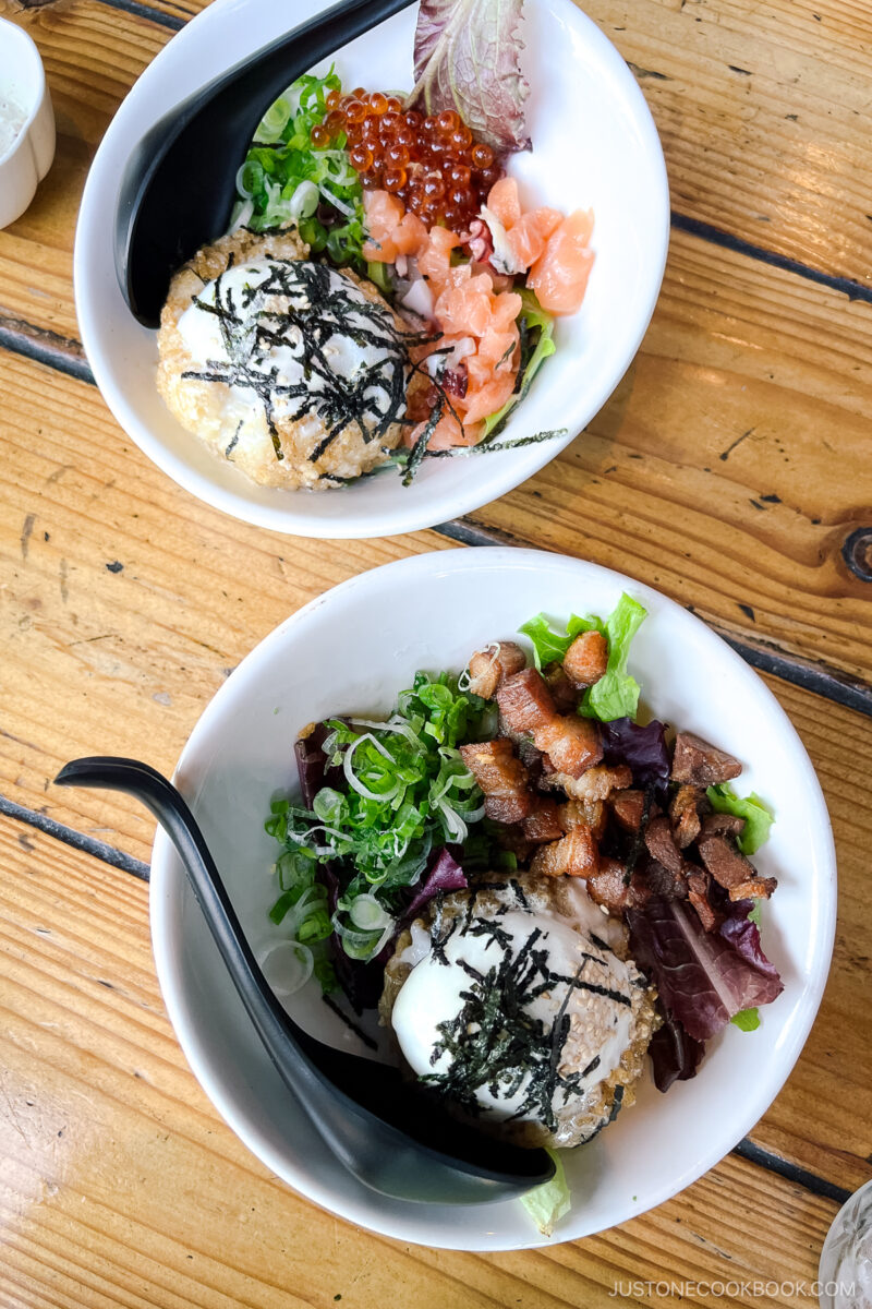 two bowls of egg benedict over rice