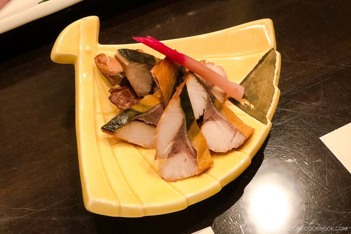 grilled fish on a yellow plate