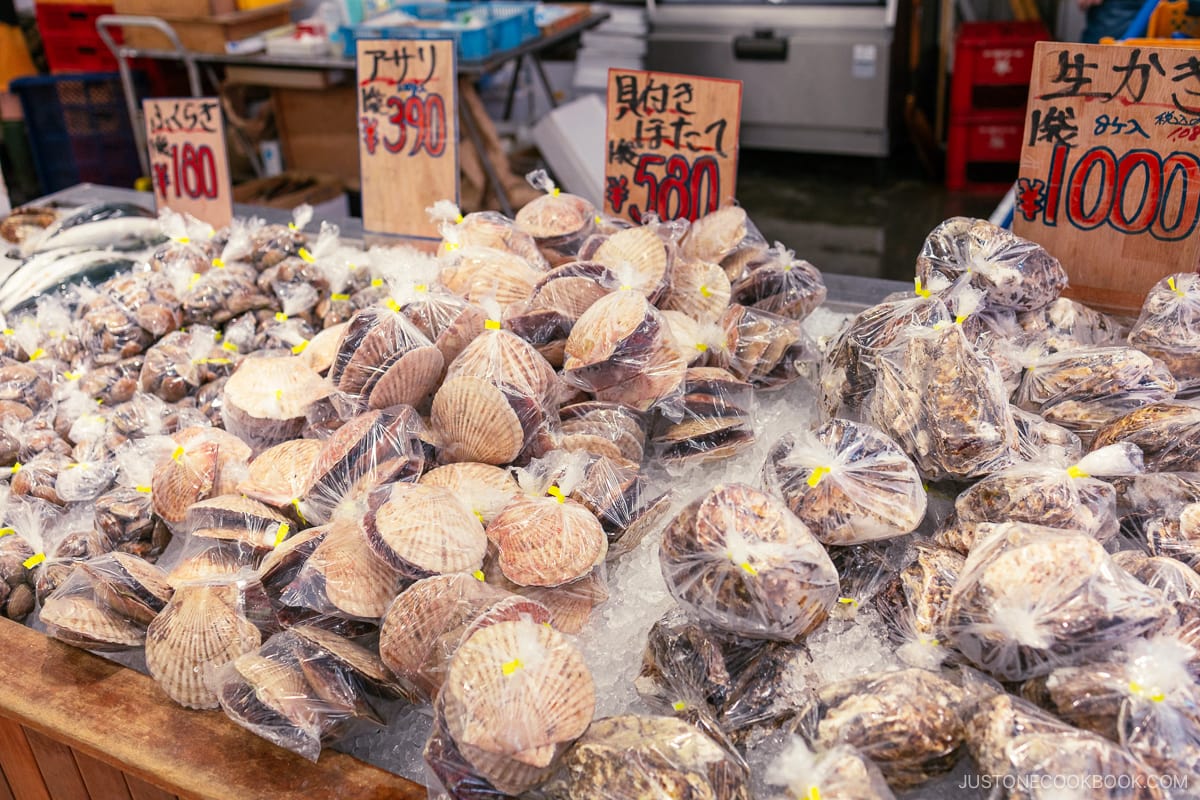 Packaged scallops, oysters and clams on an ice counter