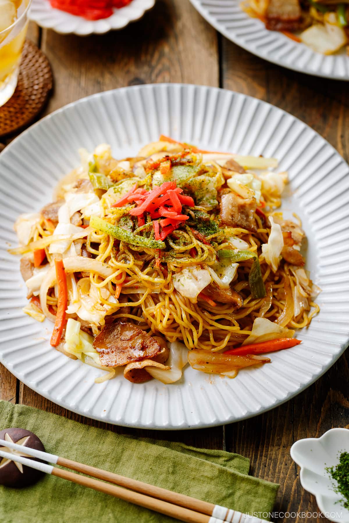 A fluted plate containing Yakisoba (Japanese Stir-Fried Noodles).