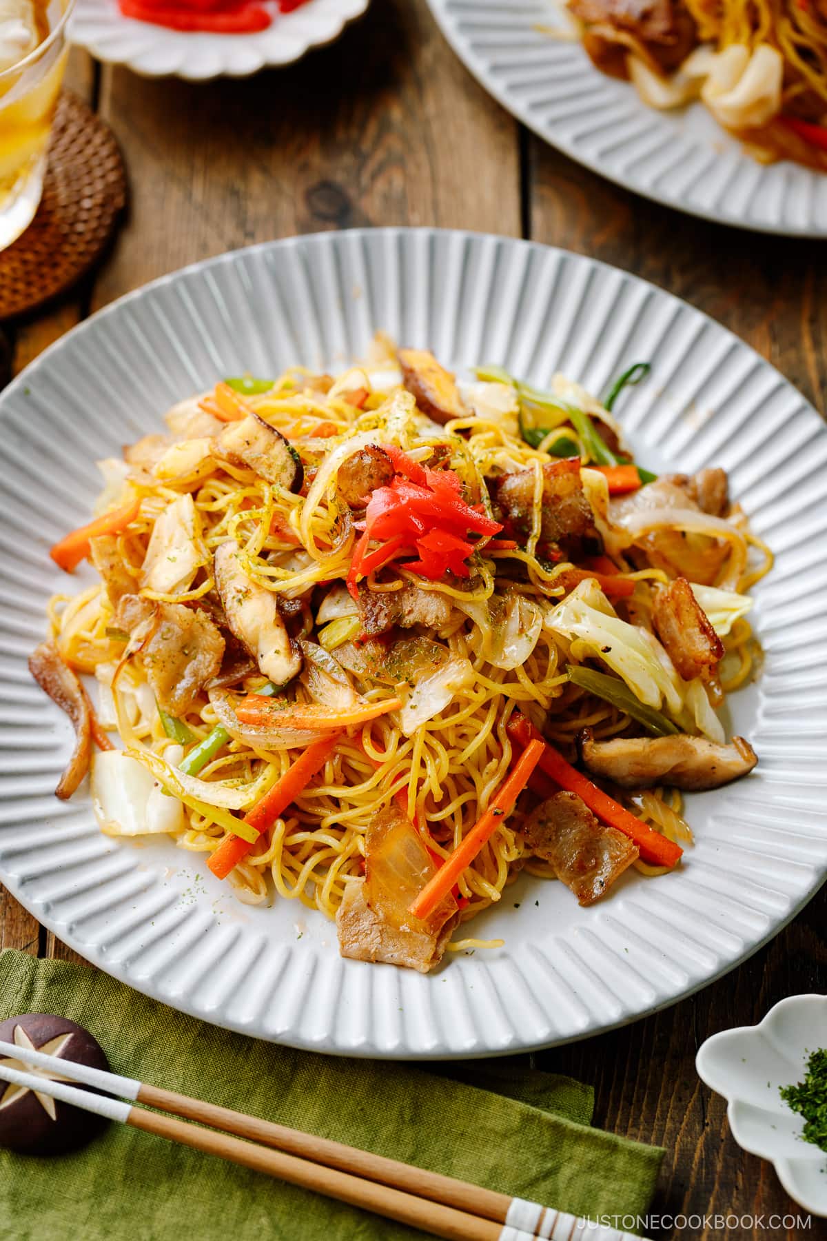 A fluted plate containing Yakisoba (Japanese Stir-Fried Noodles).