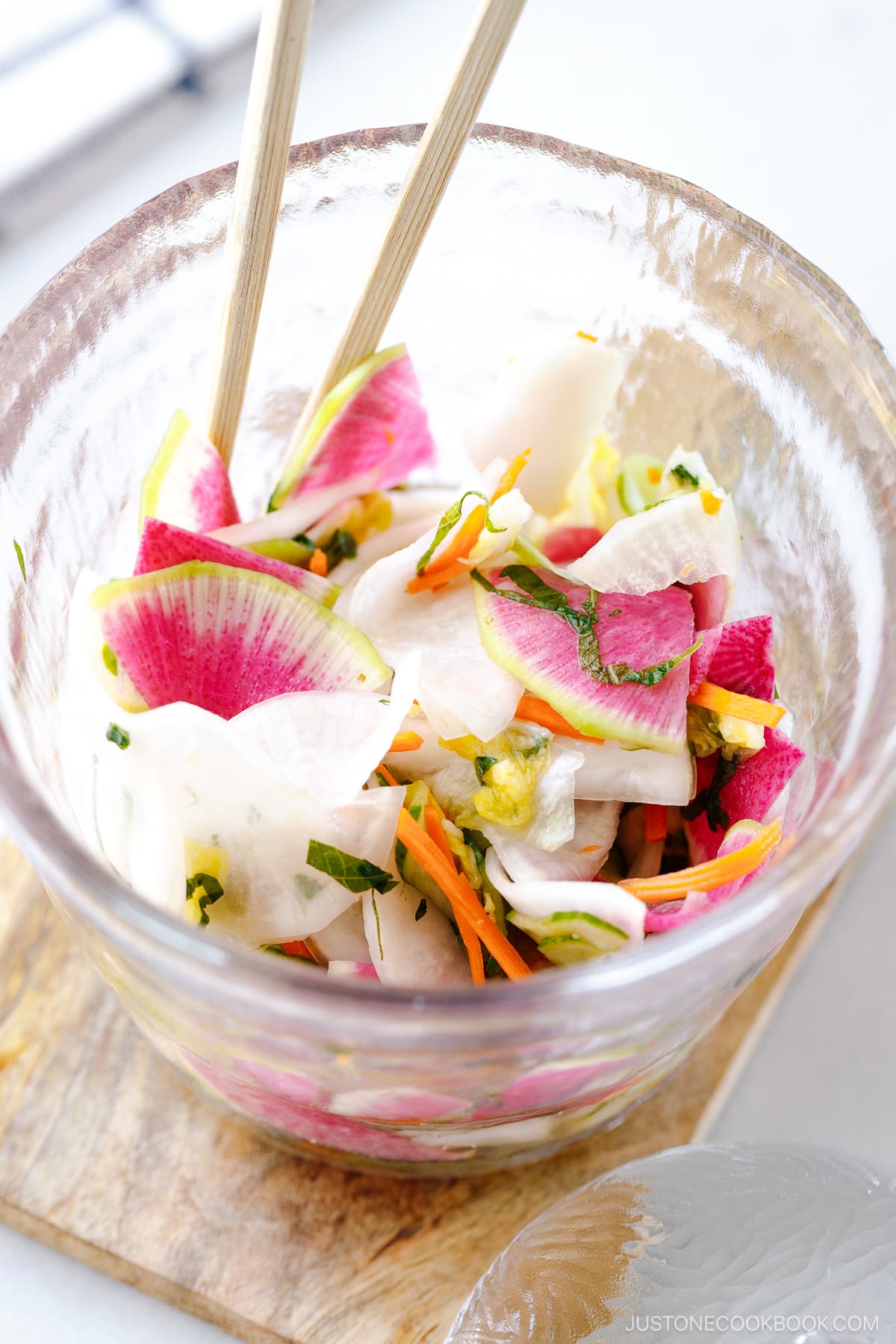 A glass picking jar containing my favorite and go-to Japanese pickles made with colorful vegetables seasoned with salt, kombu, and sugar.