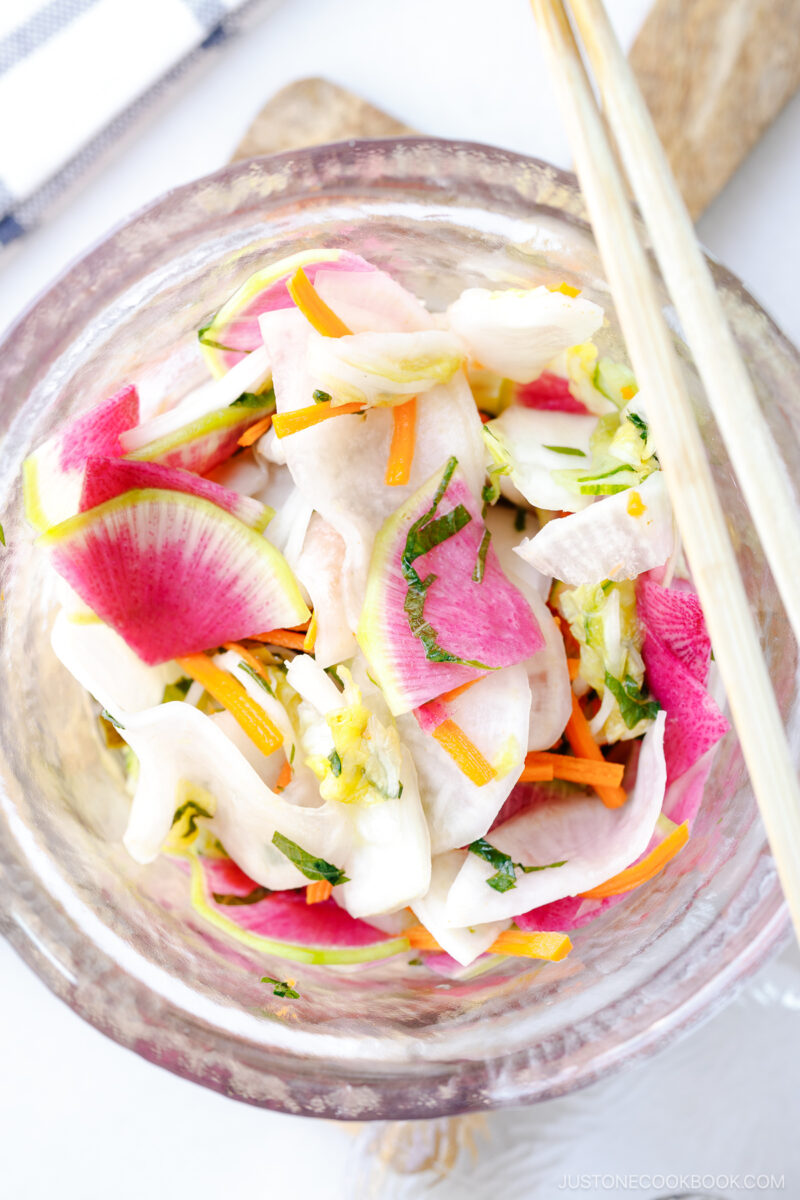 A glass picking jar containing my favorite and go-to Japanese pickles made with colorful vegetables seasoned with salt, kombu, and sugar.