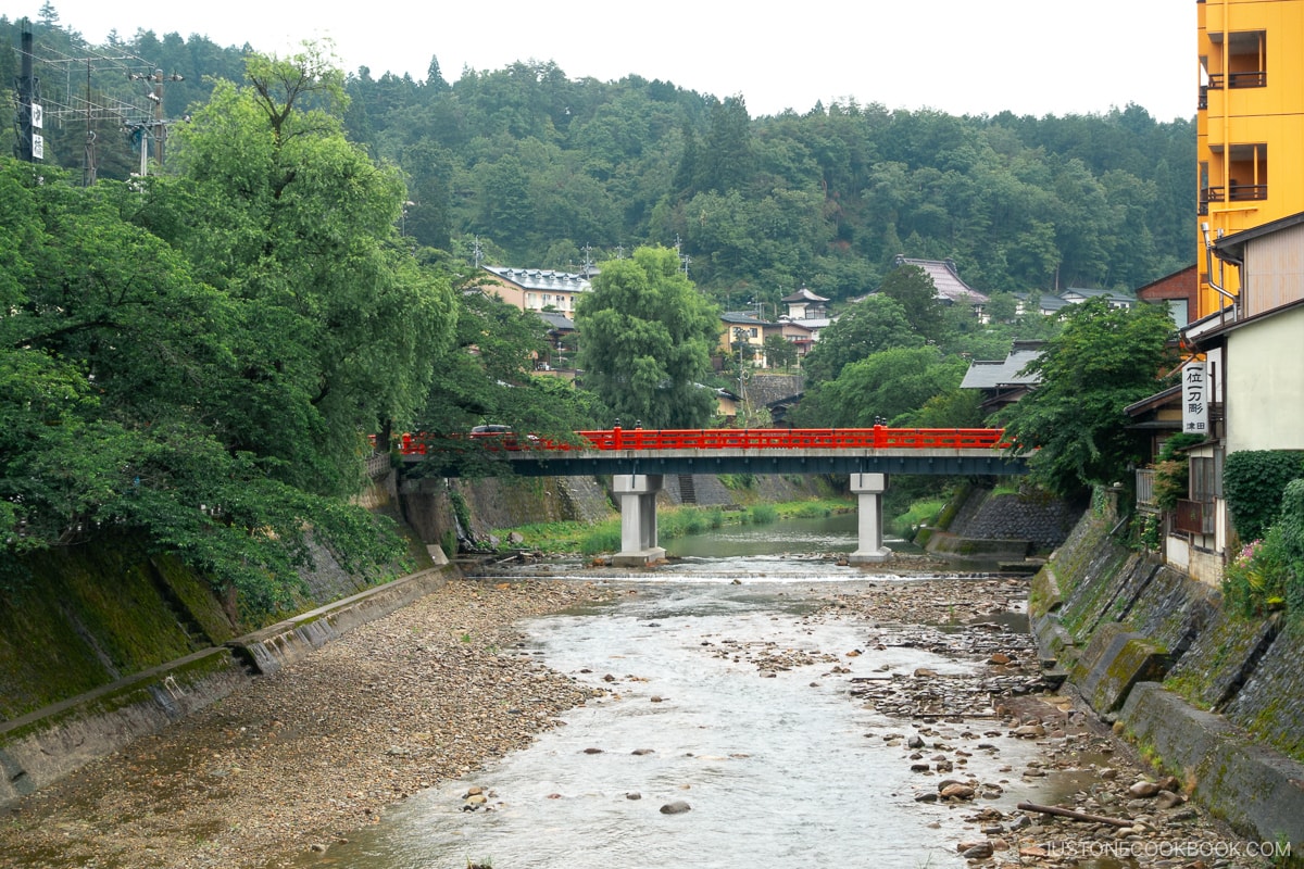 Red bridge running across the river