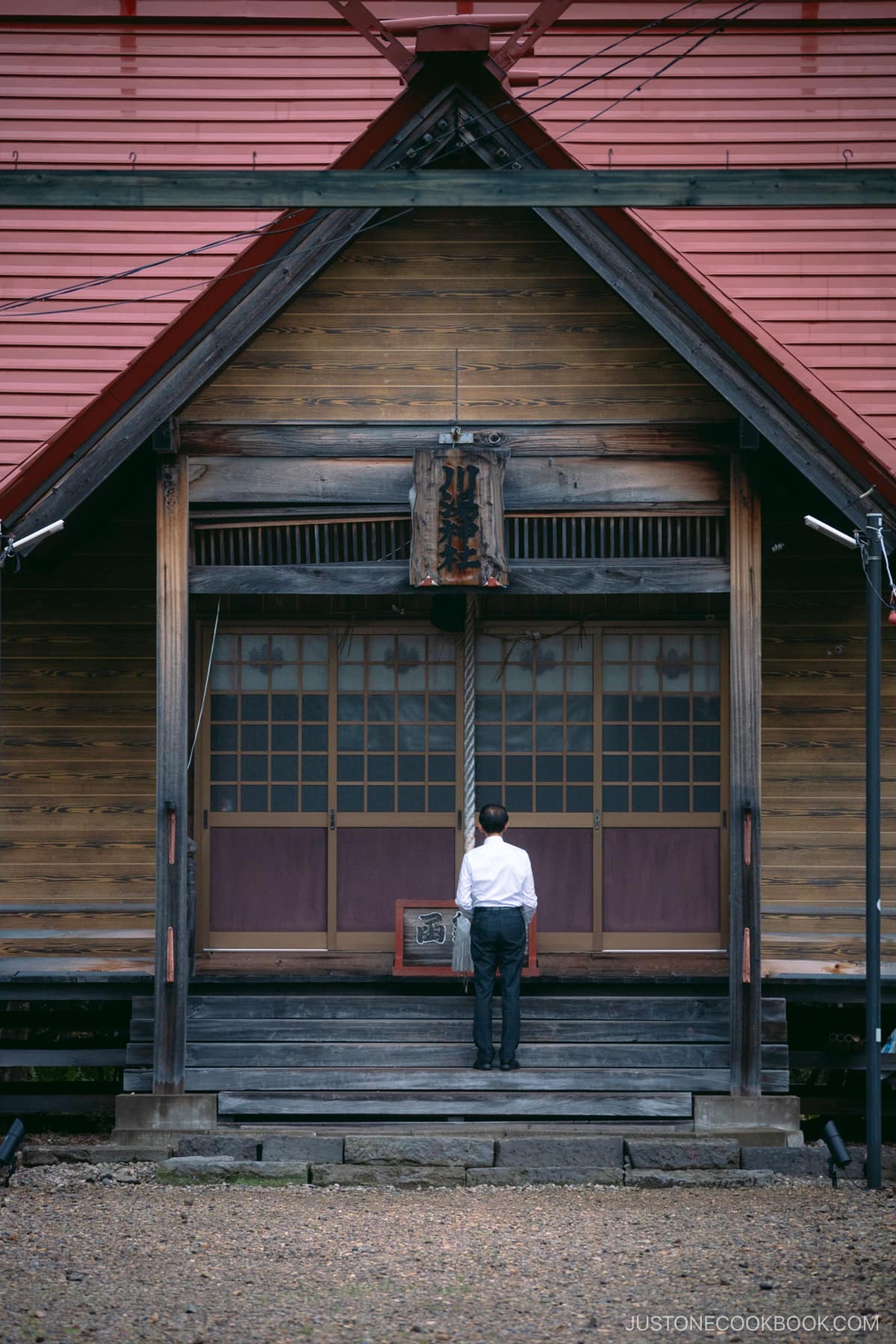 Man praying at Kawayu Shrine