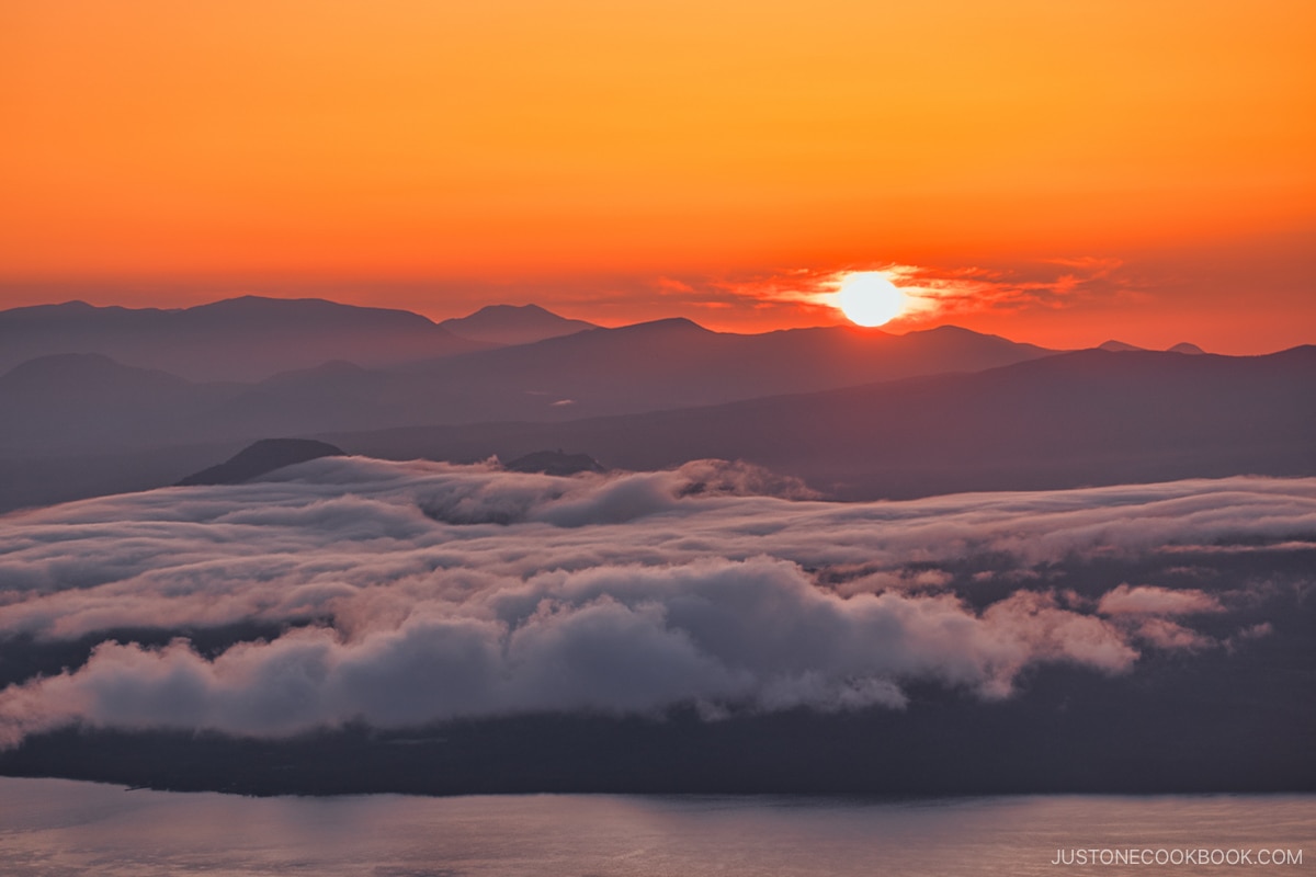 The morning sun and sea of clouds over Lake Kussharo, Hokkaido, Japan