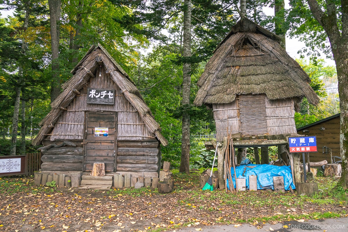Traditional thatched roofed houses at Lake Akan Ainu Kotan