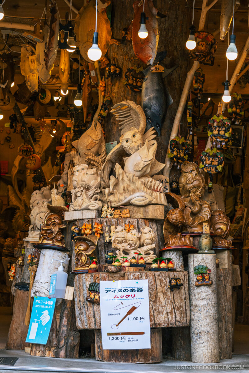 Wood carvings on sal at a craft shop at Lake Akan Ainu Kotan