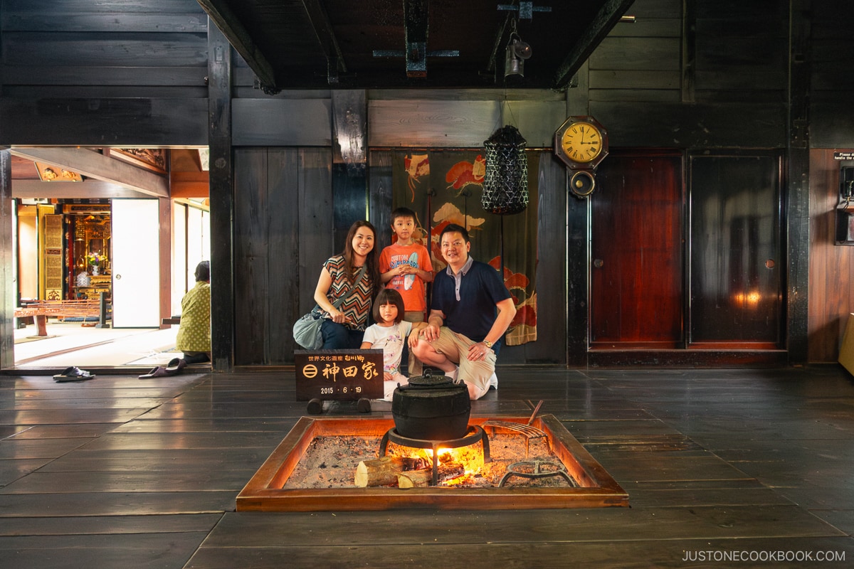 Family room with live gire and hearth in Gassho-Zukuri house