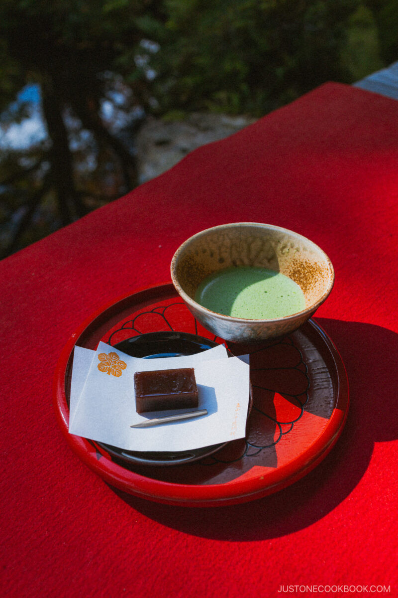 Matcha and red bean paste cake on a red carpet