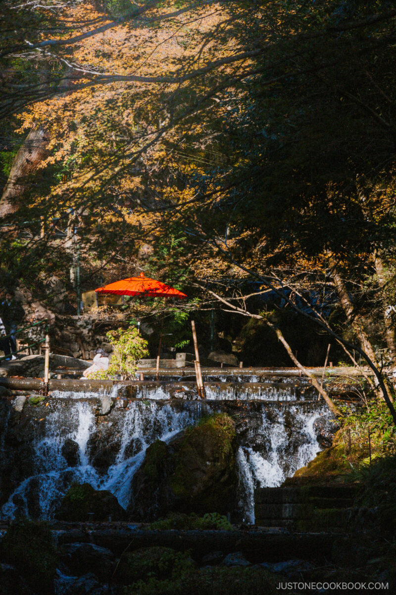 Red umbrella and seating area on the river