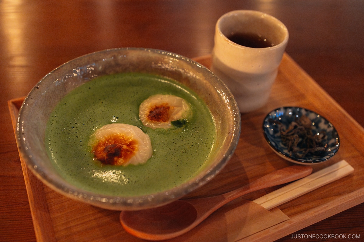 Grilled mochi on top of Matcha and red beans.