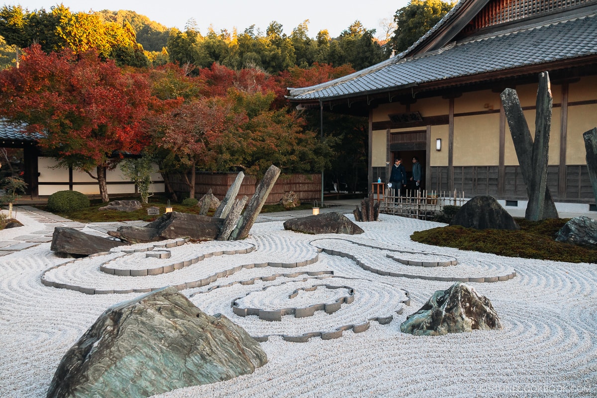 Stone and sand garden that looks like a dragon emerging from the clouds.