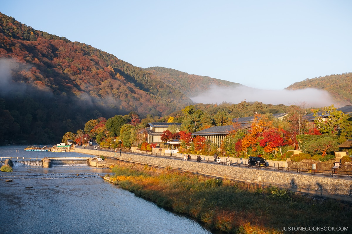 Arashiyama mountains covered with colorful autumn leaves at dawn