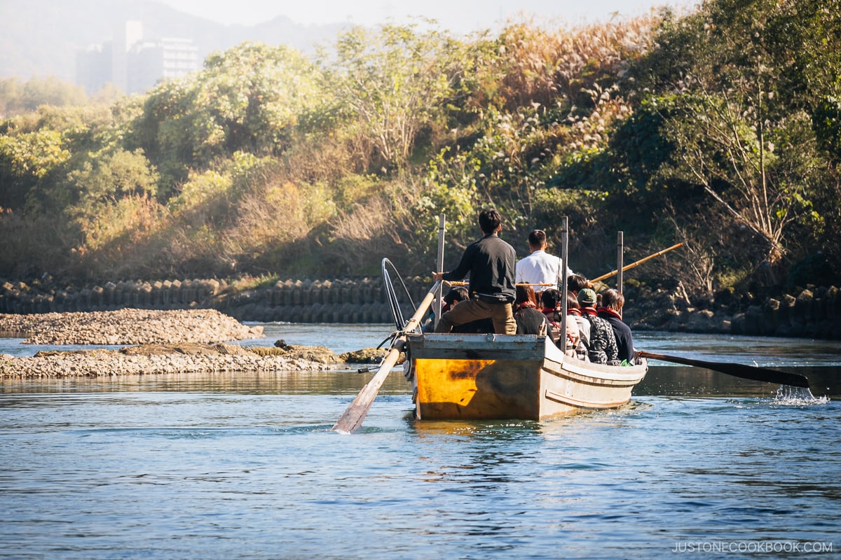 Passengers and crew on a wooden boat