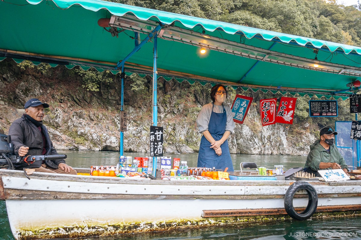 Boat with staff serving drinks and food