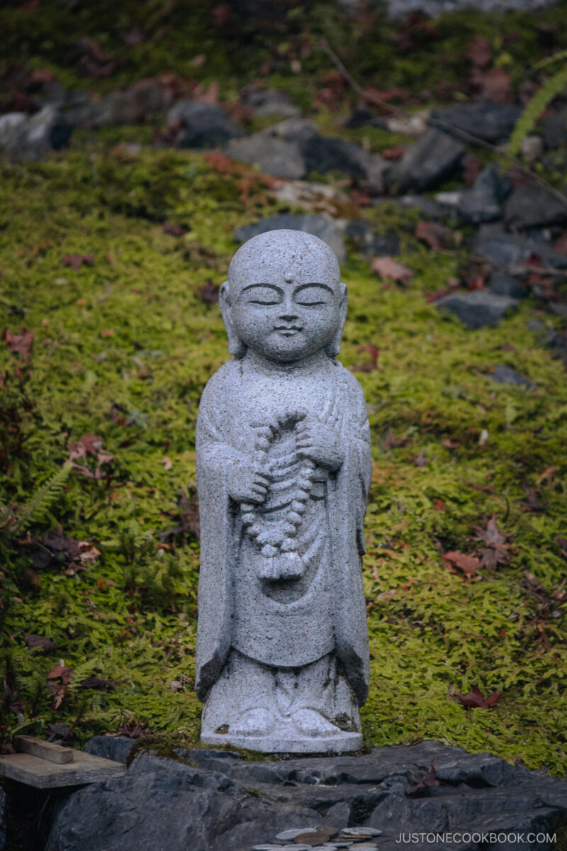 Small stone statue of a Buddha