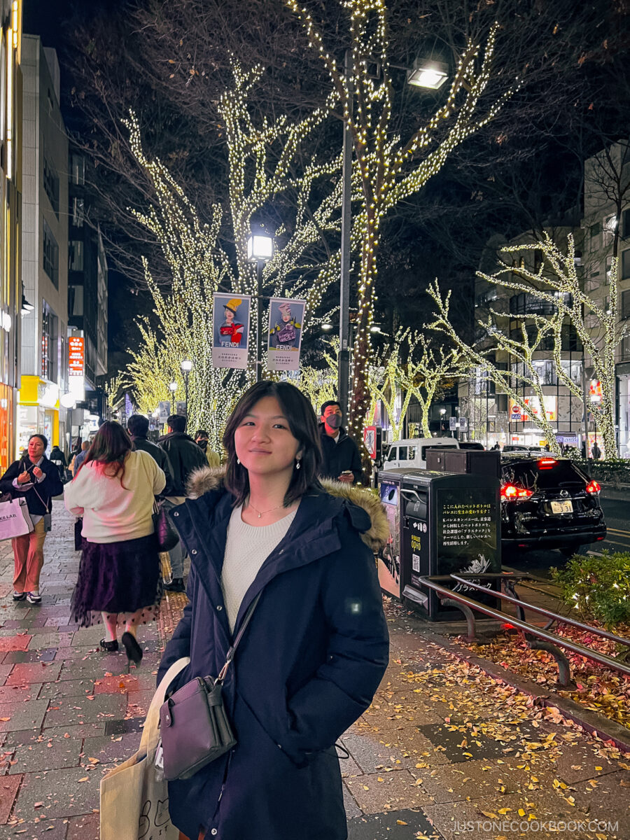 Family photo in front of illuminated trees