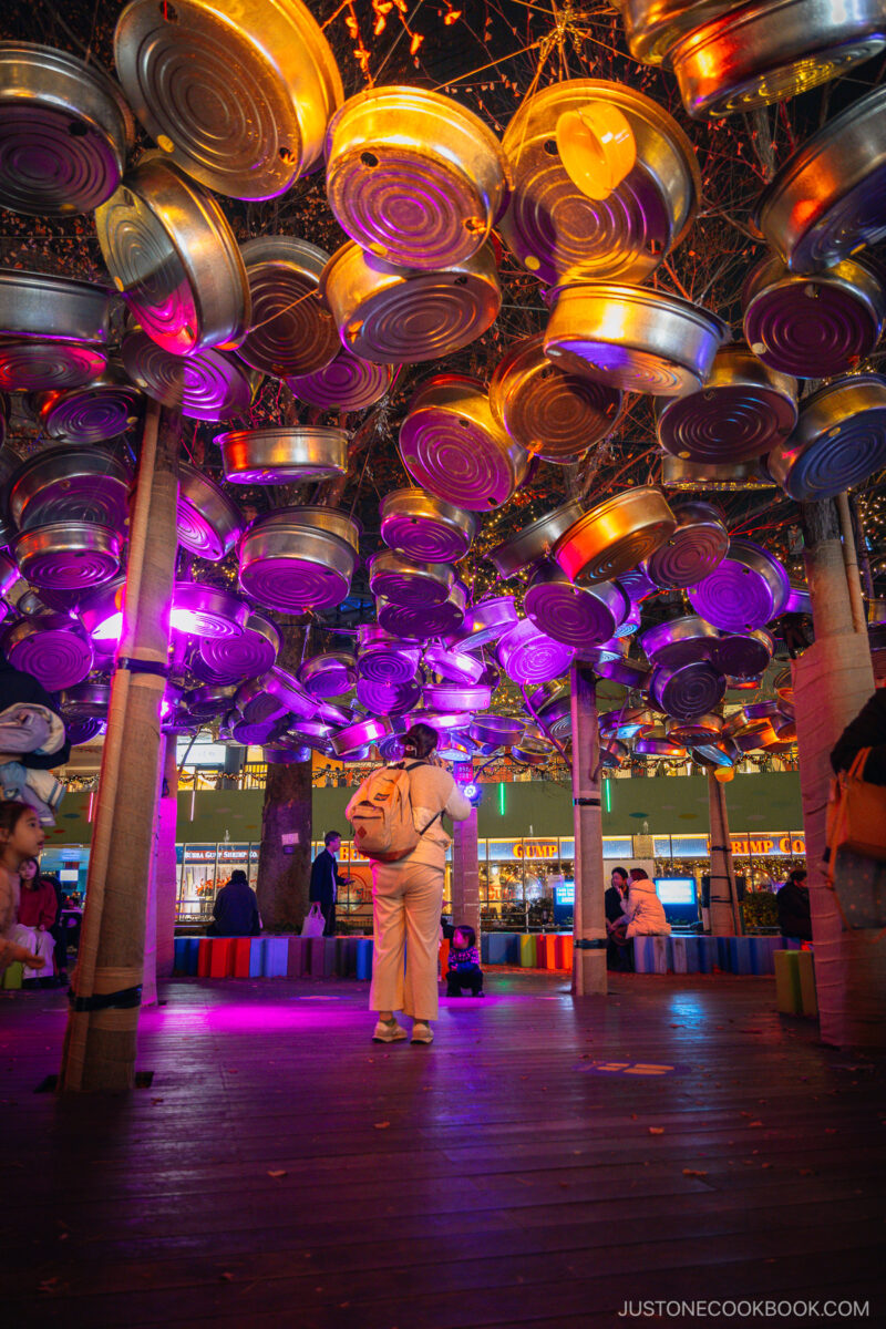 Illuminated play area under hanging silver wash tubs