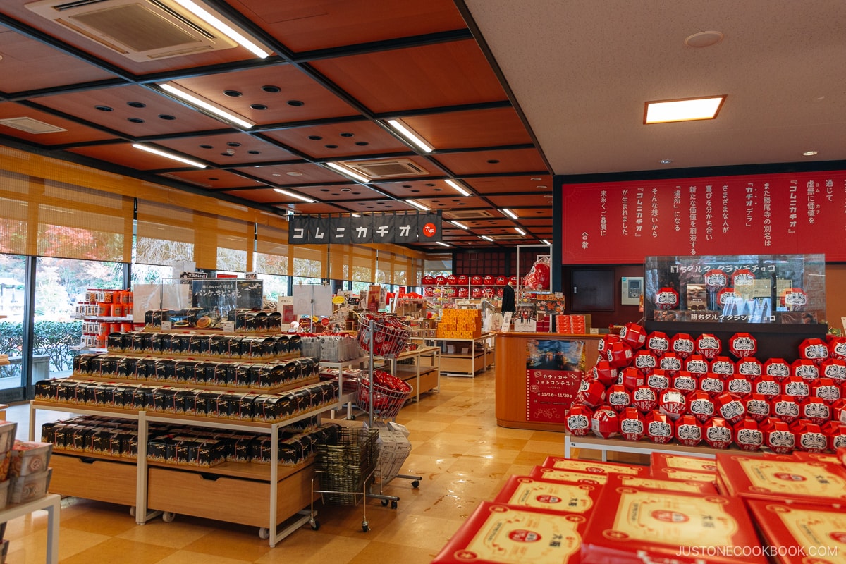 Inside of a souvenir shop selling daruma style sweets