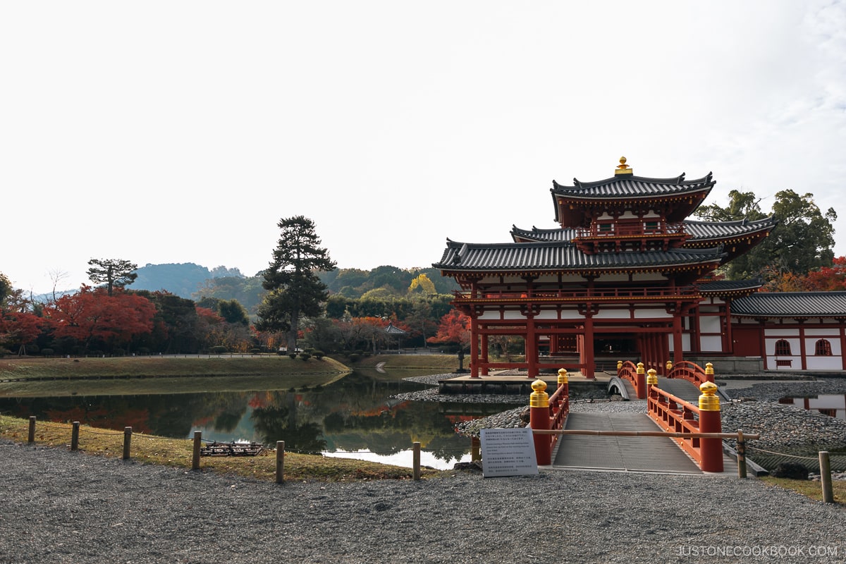 Temple surrounded by a moat and autumn leaves