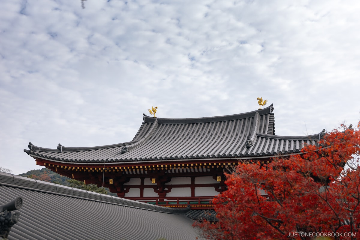 Temple roof topped with two golden phoenix statues