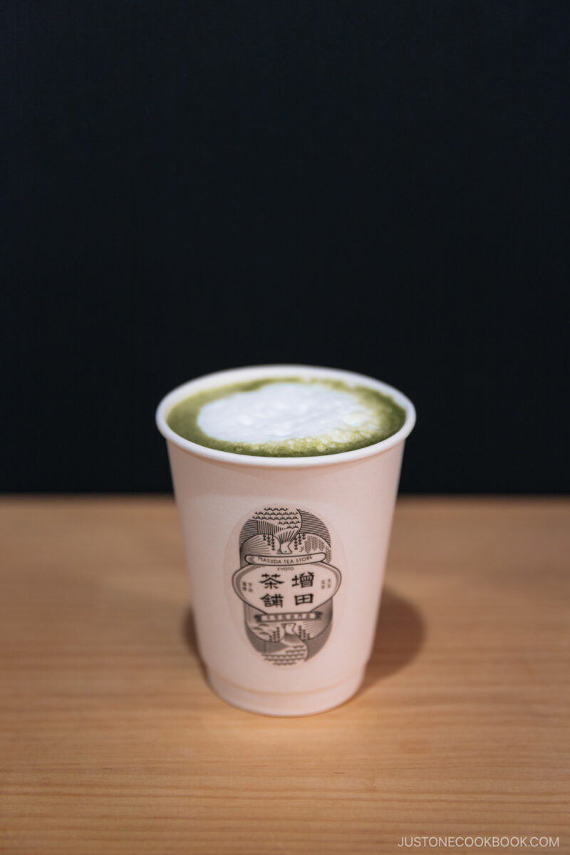Matcha tea latte in a paper cup