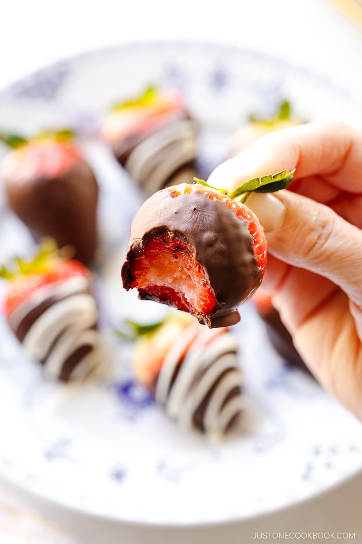 A little bite on homemade chocolate covered strawberries.
