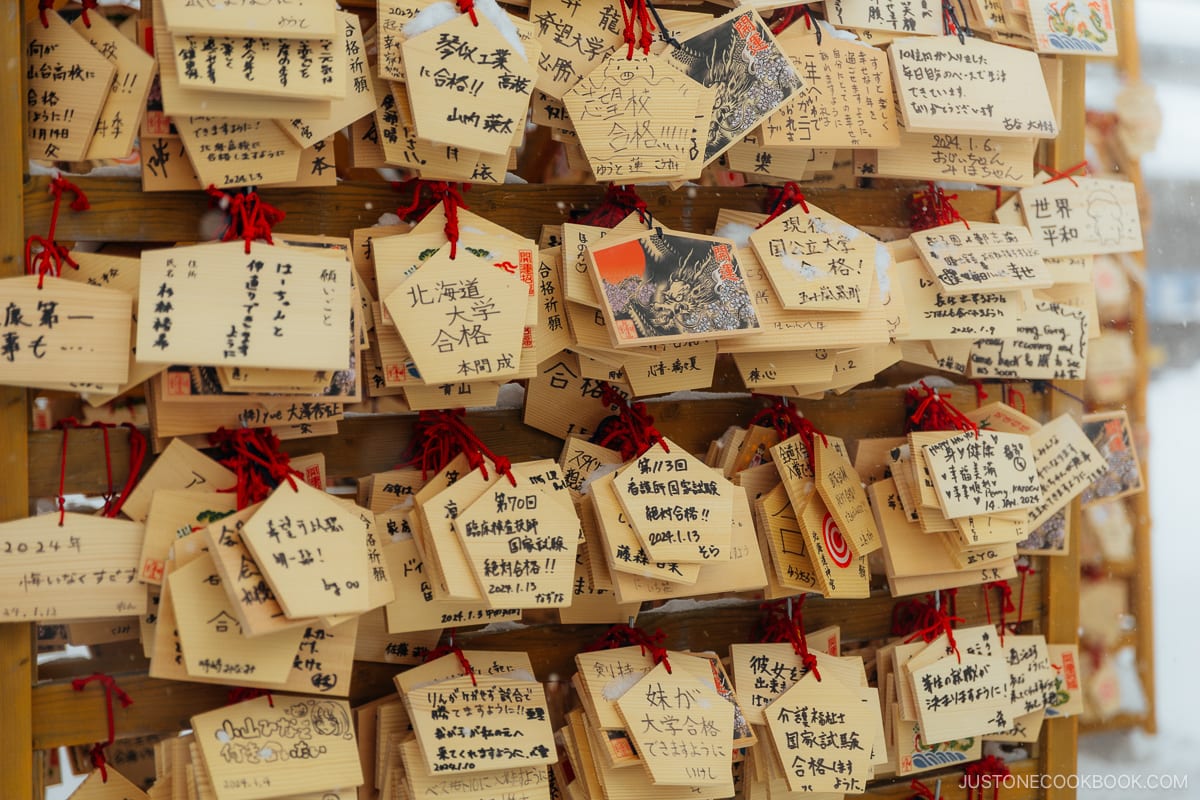 Ema wooden plaques with wishes written on them