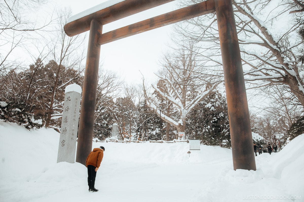 Bowing at the torii gate before entering