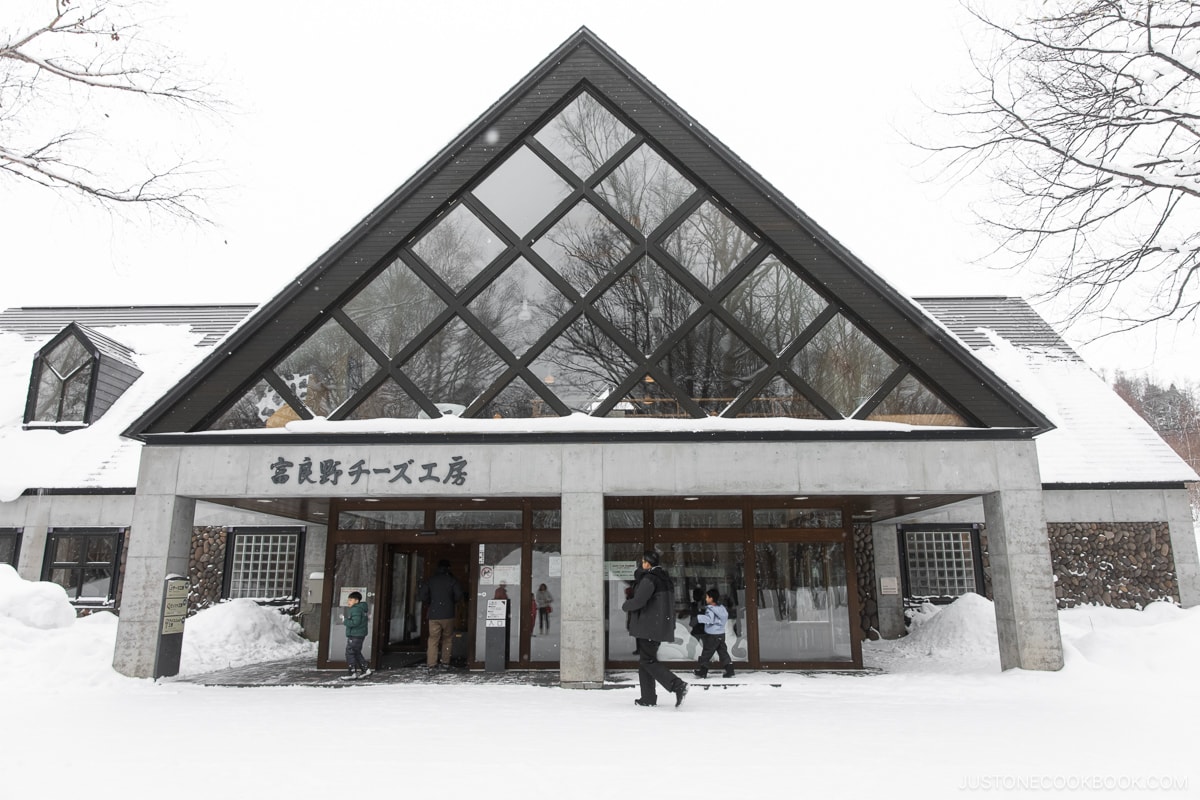 Exterior of Furano Cheese Factory covered in snow