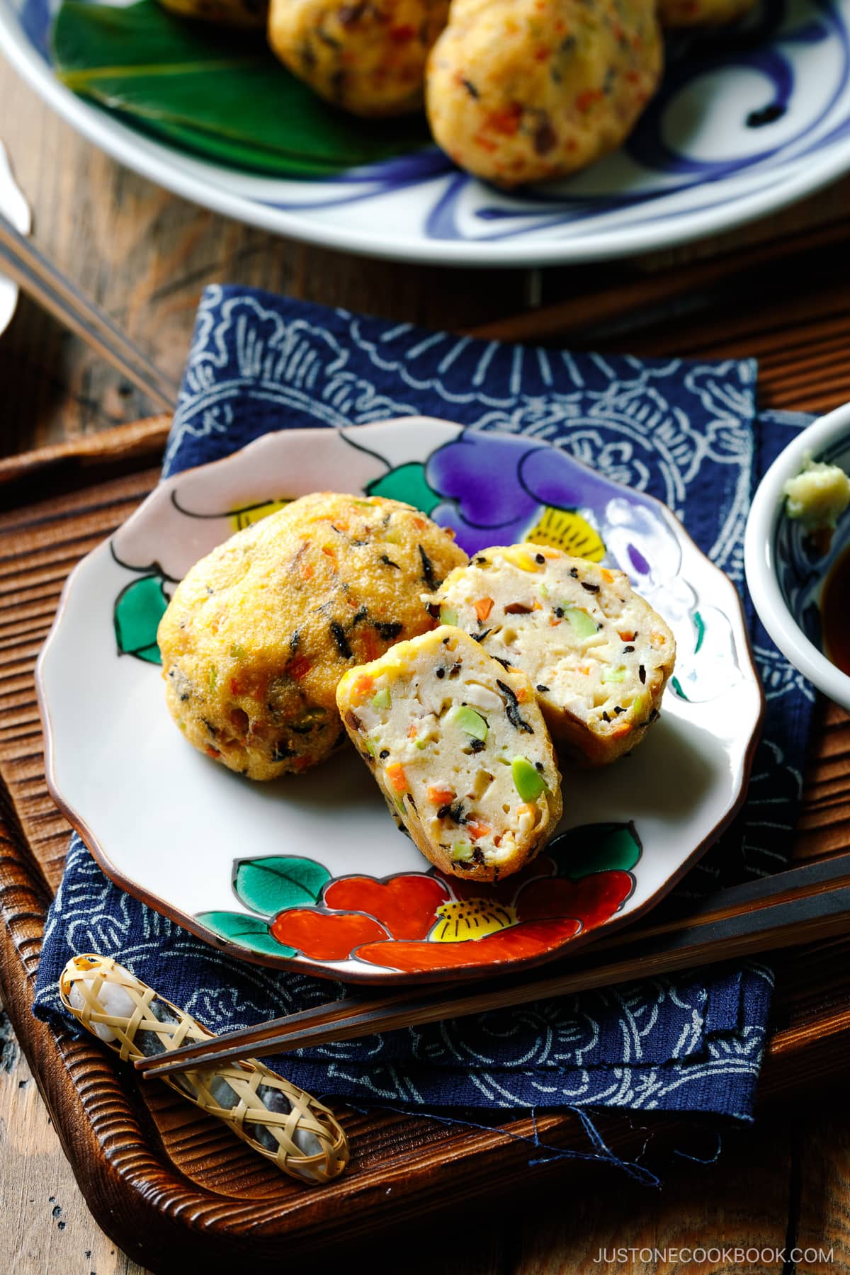 Japanese plates containing Ganmodoki (Japanese fried tofu patties).