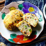 Japanese plates containing Ganmodoki (Japanese fried tofu patties).