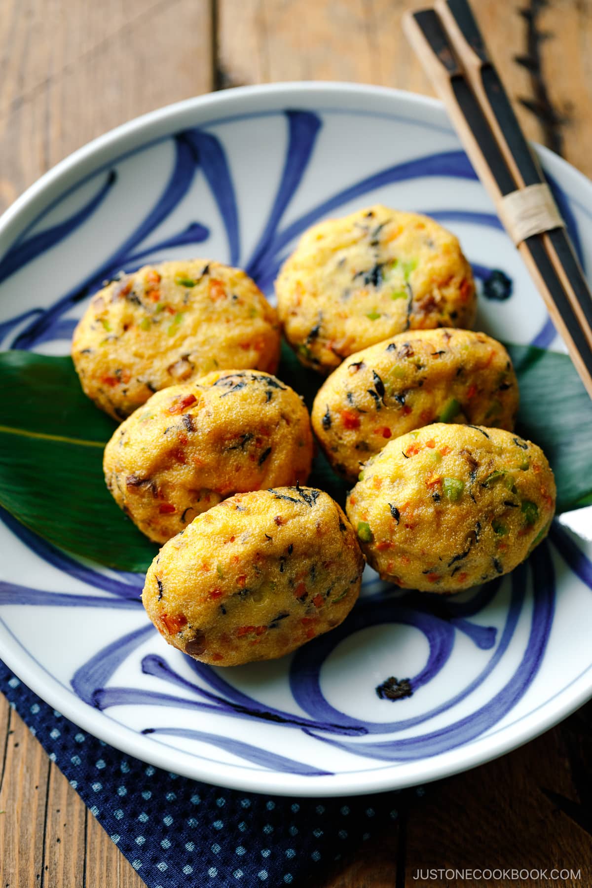 Japanese plates containing Ganmodoki (Japanese fried tofu patties).