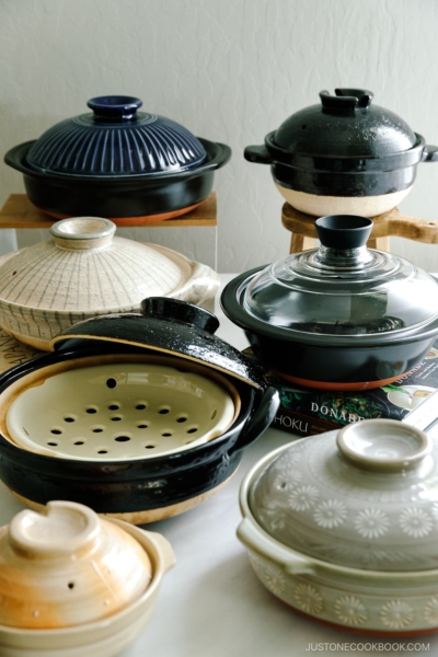 Varioius types of donabe, Japanese clay pots on the table.