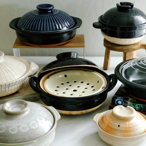 Varioius types of donabe, Japanese clay pots on the table.