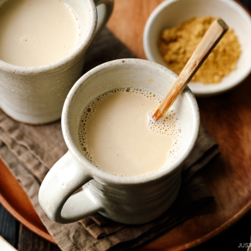 Handmade ceramic mug cups containing hot kinako milk.