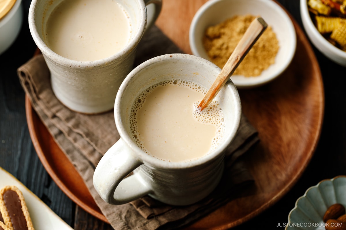 Handmade ceramic mug cups containing hot kinako milk.