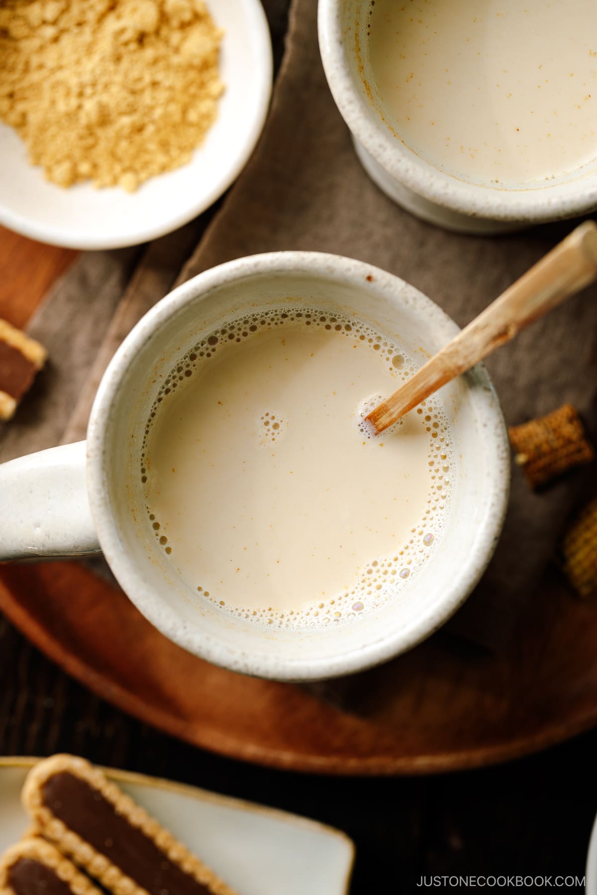 Handmade ceramic mug cups containing hot kinako milk.