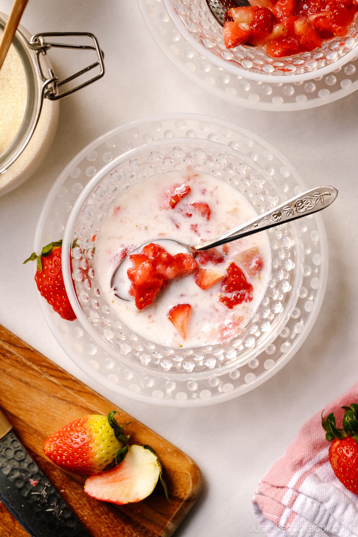 A glass bowl containing Showa-style Japanese strawberry milk called Ichigo Milk.