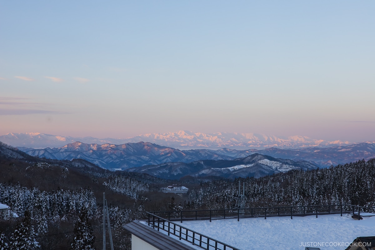 Sunrise with snowy mountains in the background